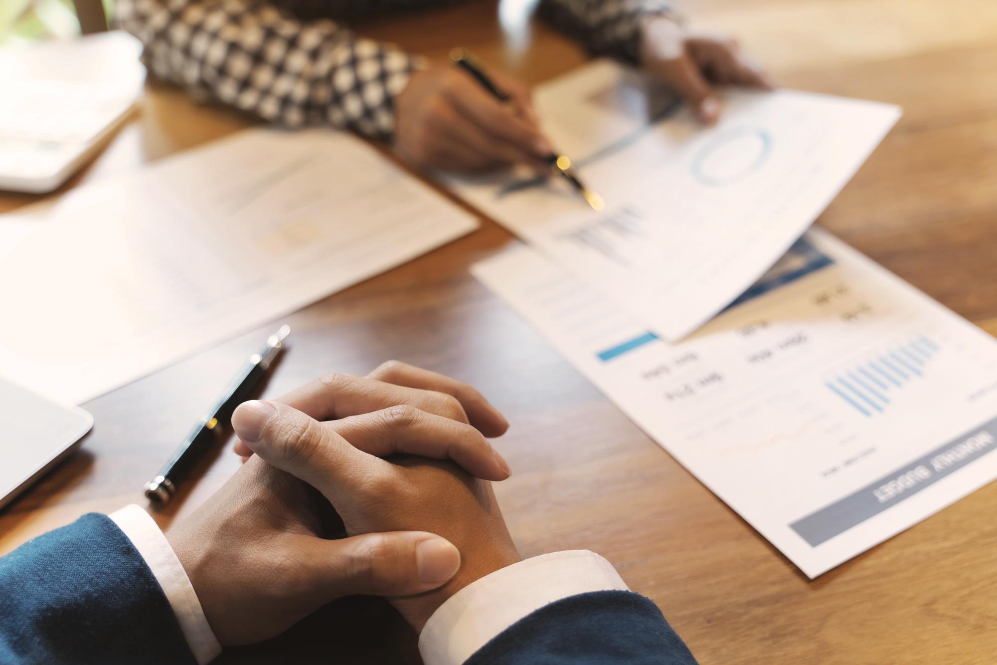 Advisor reviewing financial plans on table